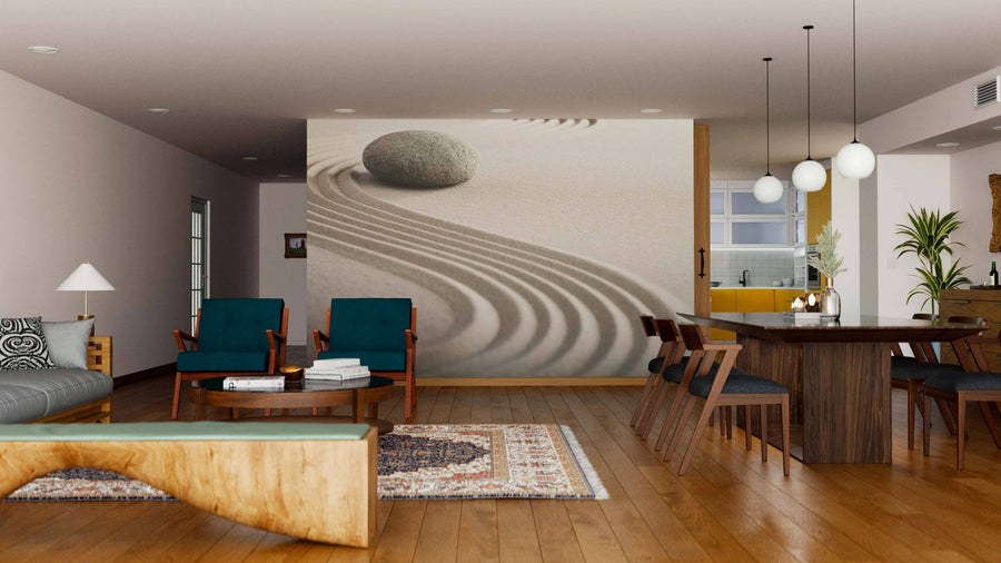 A modern open living-dining space features the Zen Garden Wall Mural with stone and raked sand. Teal armchairs, a wood coffee table, globe pendant lights, and a yellow kitchen complete the scene.