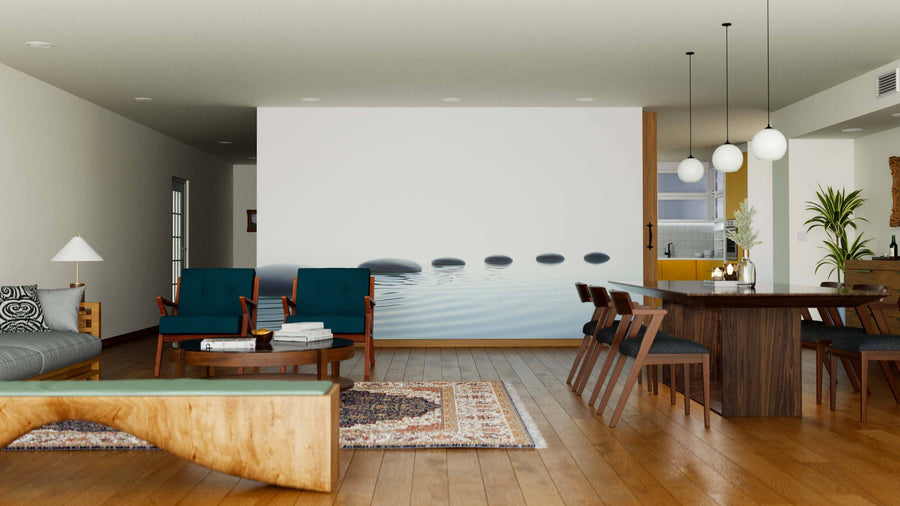 A modern living-dining area with wood floors, teal chairs, a natural wood coffee table, the Zen Path of Stones Wall Mural, a rectangular dining table for six, globe pendant lights, and warm neutral decor.