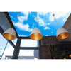 Three Clear Sky lamps hanging from a ceiling with a blue sky, creating a serene atmosphere.